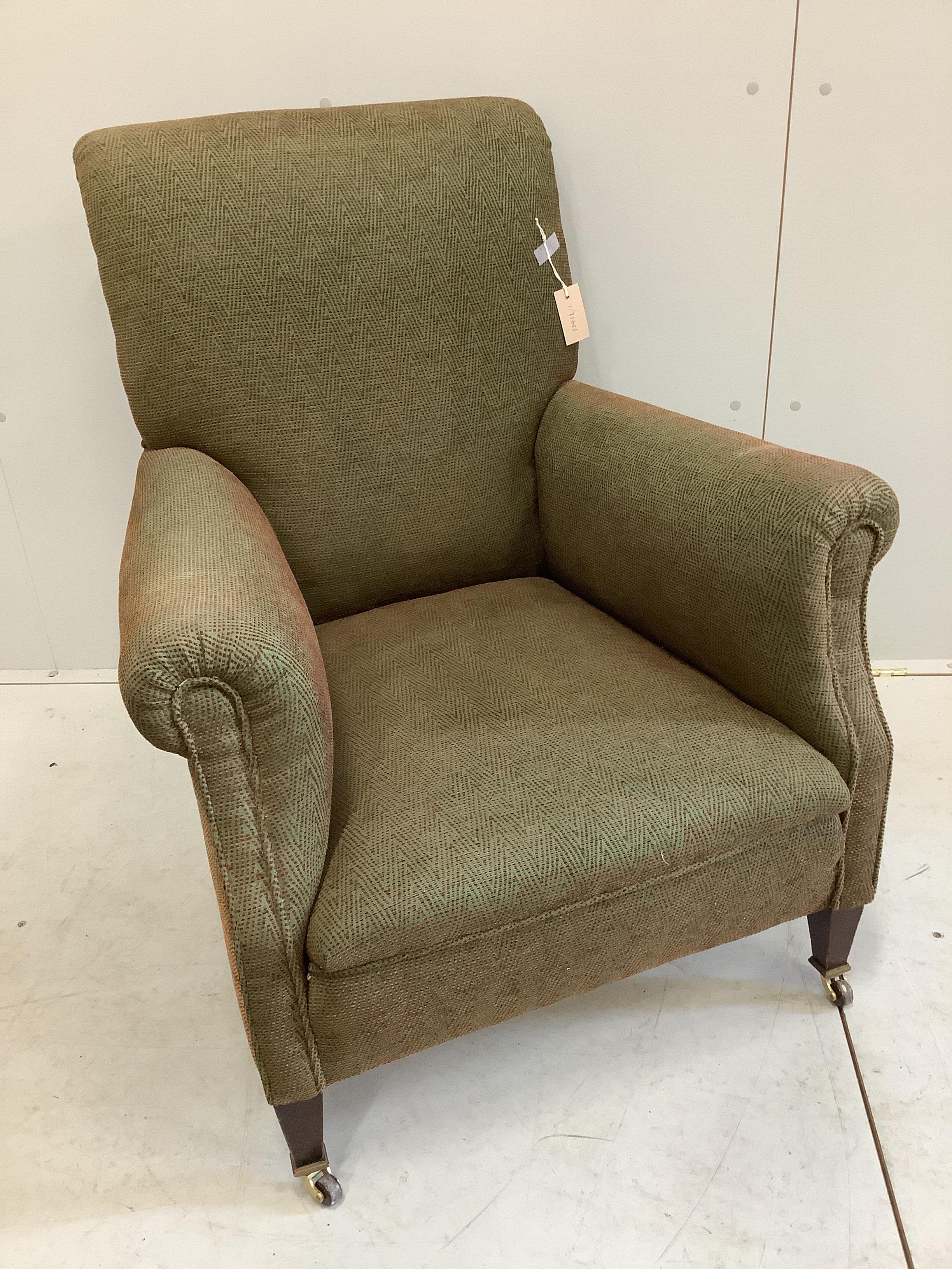 An Edwardian armchair, recently re-upholstered, width 76cm, depth 70cm, height 90cm